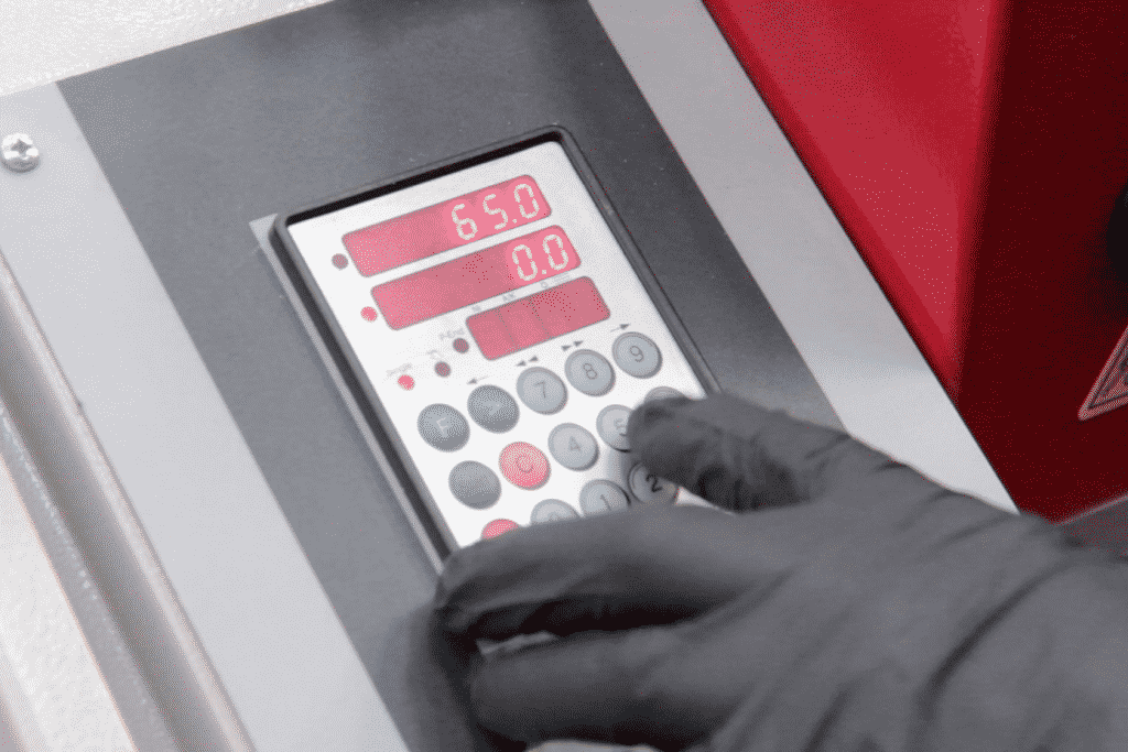Close up of a hand operating the Elgo Controller