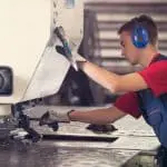 Image of engineer working a turret punch