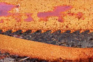 Image of a old, worn, rusty bandsaw blade