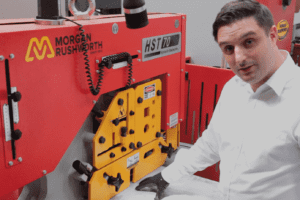Bruce Bushnell demonstrating how to adjust the material clamping system on a steelworker