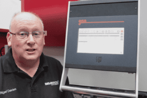 An engineer demonstrating how to use the ESA S630 Touch Control Panel