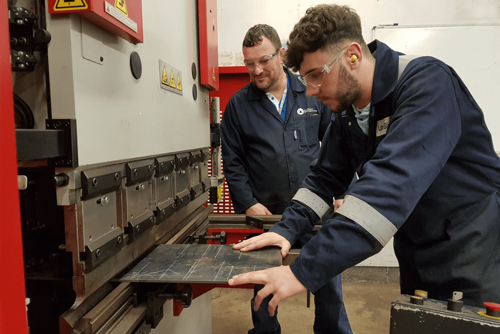 Image of apprentice and Pembrokeshire college lecturer using a Morgan Rushworth Press Brake