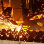 Close up of a Laser head cutting steel