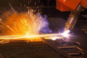 Detail of the plasma cutting head cutting metal