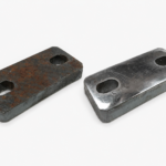Rusty and cleaned metal plate after DFR 600 deburring.