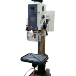 Meyer SR50TAE pillar drill with a tall grey metal column, large black motor housing at the top, red emergency stop button, adjustable table with crank handle, and a base mounted on a workshop floor."
