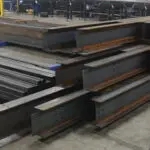 Stacks of freshly laser cut Steel Beams