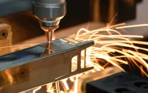 Close up of a Tube Laser Cutting out parts of a piece of square box section