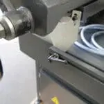 Adjustable material stop assembly