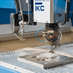 Detail of a waterjet cutting on an axis