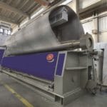 Large oval sheet metal being rolled on a MG CNC Bending Rolls