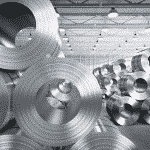 Stacks of metal alloy tube in a warehouse